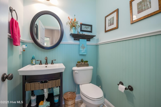 844 E Darden Rd, Faison, NC 28341 - bathroom with toilet, wainscoting, and a sink