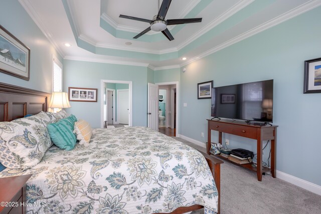 844 E Darden Rd, Faison, NC 28341 - bedroom with ornamental molding, baseboards, a tray ceiling, a ceiling fan, and carpet floors