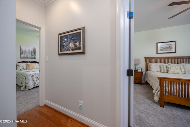 844 E Darden Rd, Faison, NC 28341 - carpeted bedroom with baseboards, ornamental molding, and wood finished floors