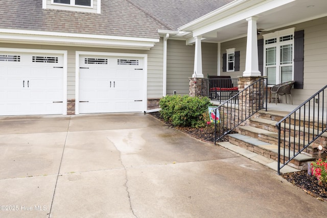 844 E Darden Rd, Faison, NC 28341 - doorway to property with roof with shingles, concrete driveway, covered porch, and stone siding