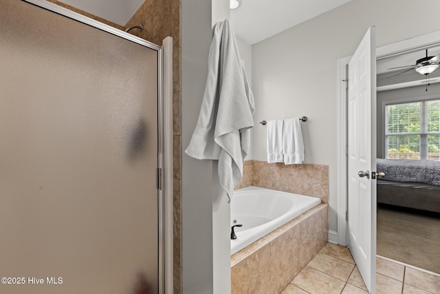 605 Stagecoach Dr, Jacksonville, NC 28546 - bathroom with ensuite bath, a shower stall, a garden tub, tile patterned flooring, and ceiling fan