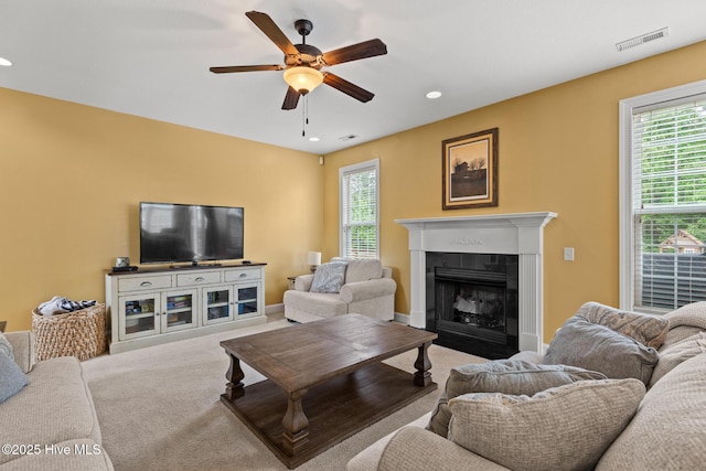 605 Stagecoach Dr, Jacksonville, NC 28546 - carpeted living room with a ceiling fan, healthy amount of natural light, a fireplace with flush hearth, and recessed lighting