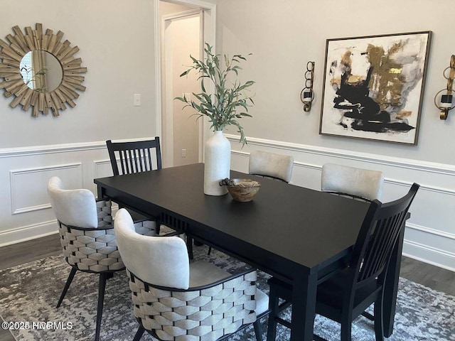 1217 Pelican Dr, New Bern, NC 28560 - dining space featuring wood finished floors, a decorative wall, and wainscoting