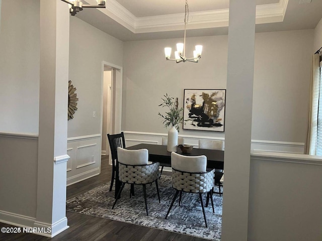 1217 Pelican Dr, New Bern, NC 28560 - dining space featuring a chandelier, a raised ceiling, dark wood-style floors, and crown molding