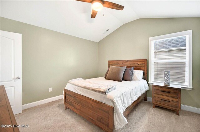 5735 Orchardgrass Rd, Leland, NC 28451 - bedroom with light colored carpet, vaulted ceiling, baseboards, and a ceiling fan