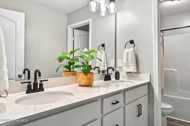 5735 Orchardgrass Rd, Leland, NC 28451 - bathroom featuring double vanity, toilet, and shower / bath combination with curtain