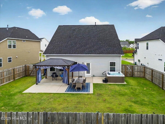 5735 Orchardgrass Rd, Leland, NC 28451 - back of property featuring a gazebo, a hot tub, a patio area, and a residential view