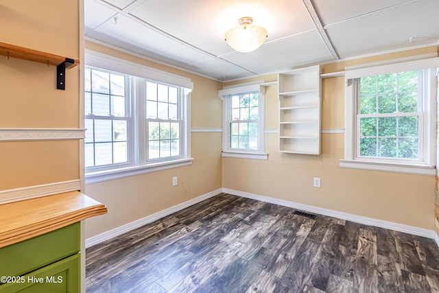 105 Queens Rd, Jacksonville, NC 28540 - unfurnished dining area with baseboards, dark wood-style floors, and crown molding