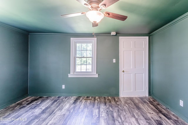 105 Queens Rd, Jacksonville, NC 28540 - unfurnished bedroom featuring wood finished floors, baseboards, and a ceiling fan