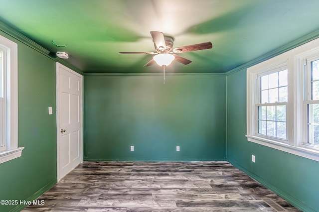 105 Queens Rd, Jacksonville, NC 28540 - empty room with a ceiling fan, healthy amount of natural light, dark wood-type flooring, and baseboards