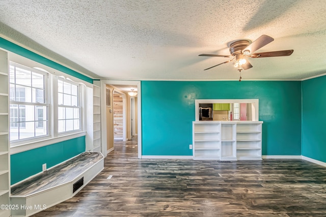 105 Queens Rd, Jacksonville, NC 28540 - unfurnished living room with a textured ceiling, a ceiling fan, baseboards, wood finished floors, and built in shelves