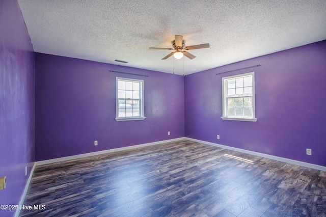 105 Queens Rd, Jacksonville, NC 28540 - empty room featuring a ceiling fan, wood finished floors, a textured ceiling, and baseboards