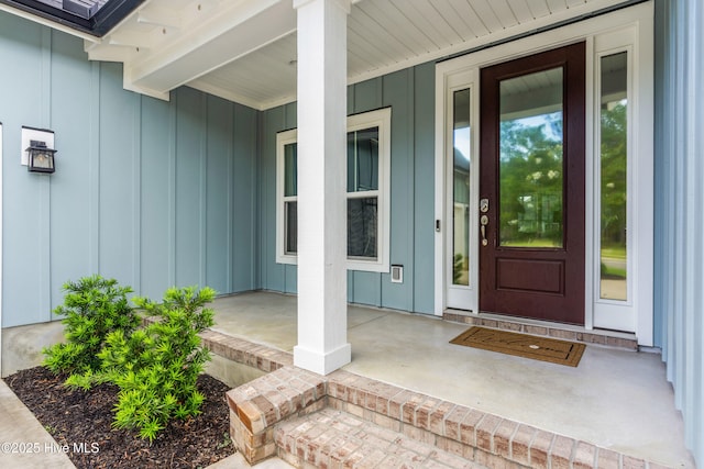 2676 W Timber Crest Dr, Leland, NC 28451 - doorway to property with board and batten siding and a porch
