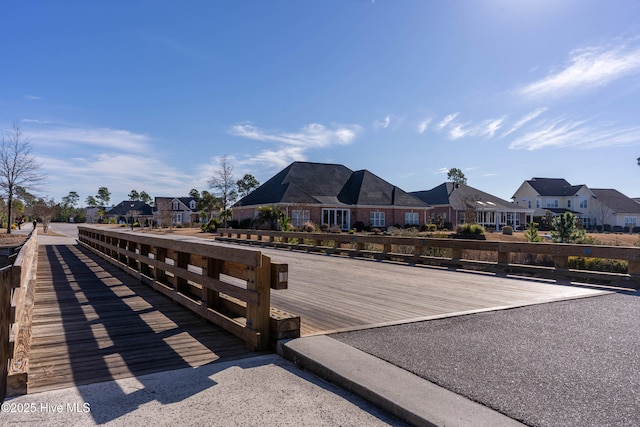 2676 W Timber Crest Dr, Leland, NC 28451 - dock area featuring a residential view and a deck