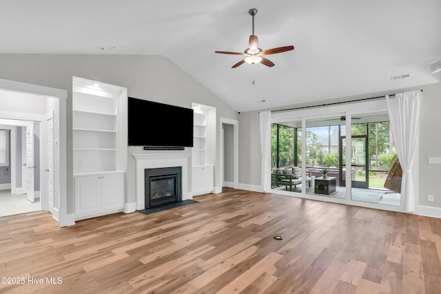 2676 W Timber Crest Dr, Leland, NC 28451 - unfurnished living room with vaulted ceiling, ceiling fan, baseboards, and light wood-style flooring