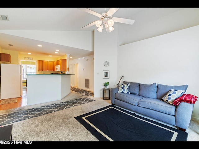 4043 Brick Path Ln SE, Southport, NC 28461 - living area with lofted ceiling, light colored carpet, recessed lighting, and ceiling fan