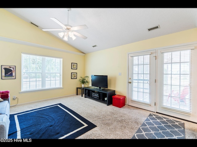 4043 Brick Path Ln SE, Southport, NC 28461 - carpeted living room with plenty of natural light, vaulted ceiling, and ceiling fan