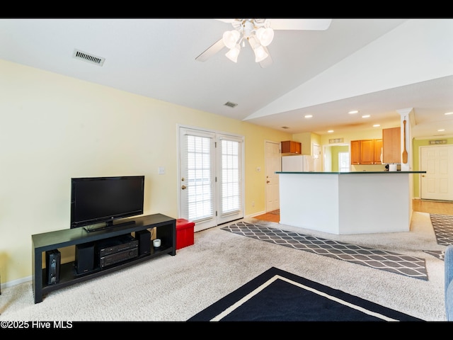 4043 Brick Path Ln SE, Southport, NC 28461 - living room with light carpet, ceiling fan, lofted ceiling, recessed lighting, and baseboards