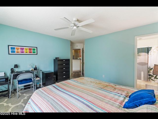 4043 Brick Path Ln SE, Southport, NC 28461 - carpeted bedroom with a ceiling fan and a desk