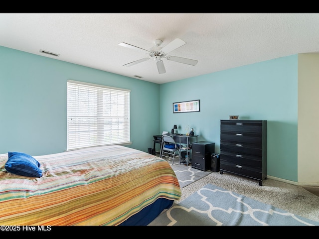 4043 Brick Path Ln SE, Southport, NC 28461 - carpeted bedroom with a ceiling fan, an office area, and baseboards