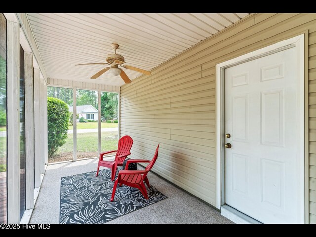 4043 Brick Path Ln SE, Southport, NC 28461 - sunroom / solarium featuring a ceiling fan