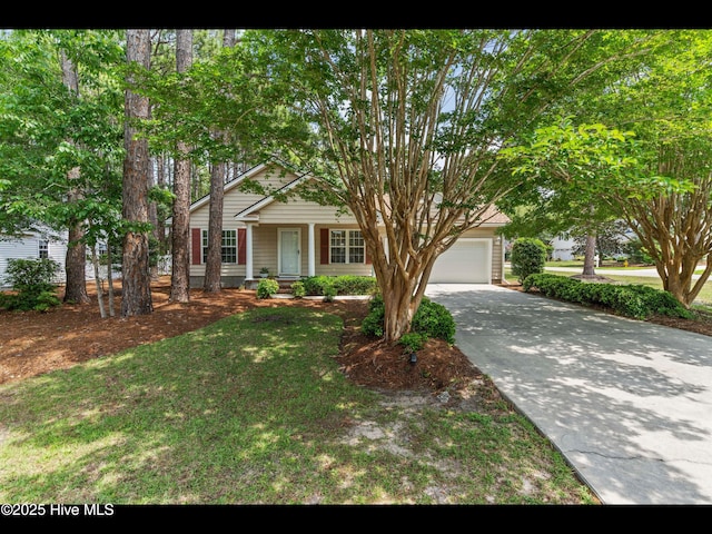4043 Brick Path Ln SE, Southport, NC 28461 - view of front of home featuring an attached garage, concrete driveway, a porch, and a front lawn