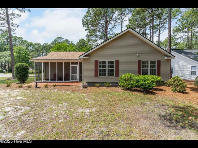 4043 Brick Path Ln SE, Southport, NC 28461 - back of property with a sunroom