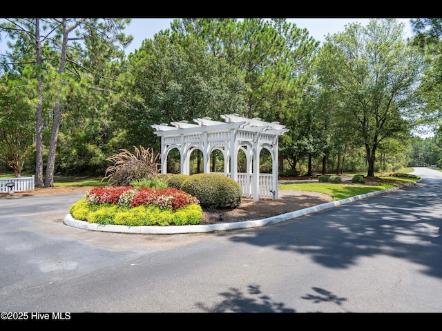 4043 Brick Path Ln SE, Southport, NC 28461 - community / neighborhood sign featuring view of wooded area