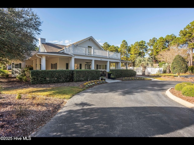 4043 Brick Path Ln SE, Southport, NC 28461 - view of front of property featuring a balcony and a chimney