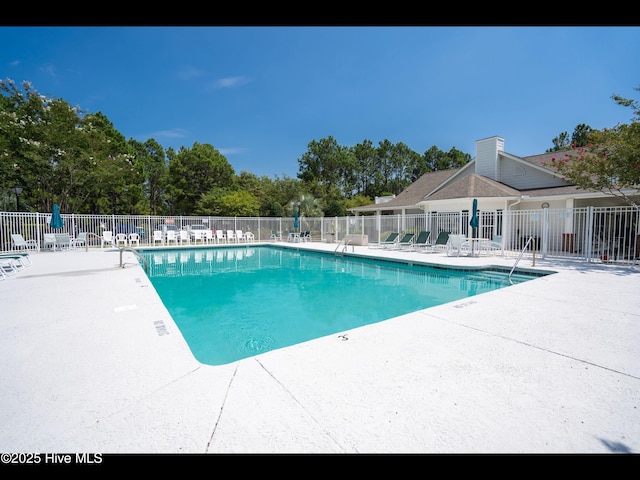 4043 Brick Path Ln SE, Southport, NC 28461 - community pool featuring a patio area
