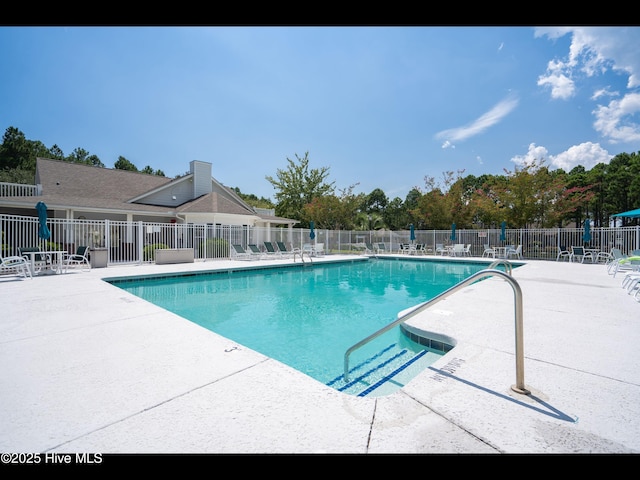 4043 Brick Path Ln SE, Southport, NC 28461 - community pool with a patio area