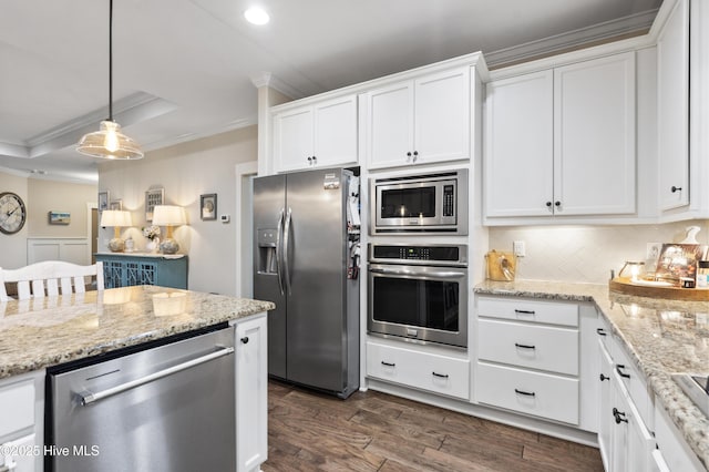 3020 Eno Ln, Leland, NC 28451 - kitchen featuring appliances with stainless steel finishes, ornamental molding, dark wood-type flooring, white cabinets, and tasteful backsplash