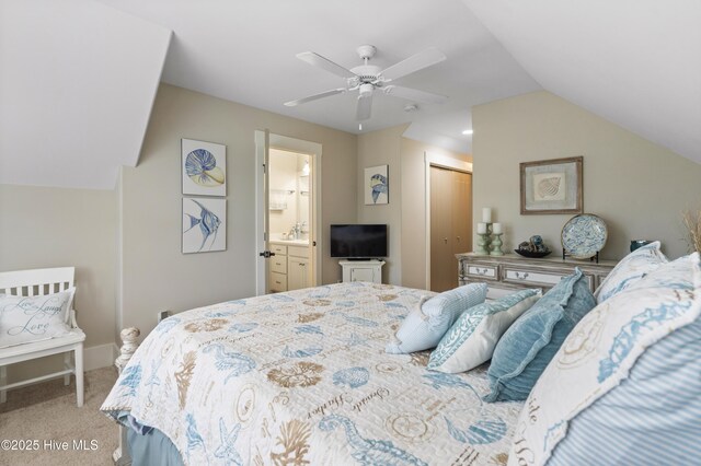 3020 Eno Ln, Leland, NC 28451 - bedroom featuring carpet floors, a closet, lofted ceiling, connected bathroom, and ceiling fan