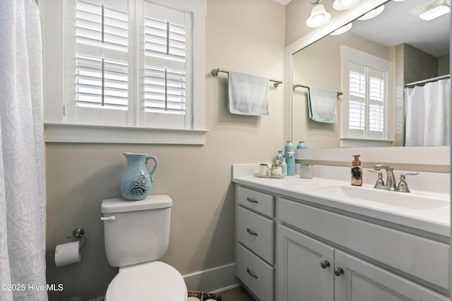 3020 Eno Ln, Leland, NC 28451 - bathroom featuring vanity, toilet, baseboards, and curtained shower