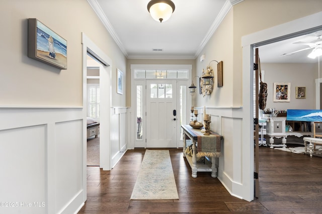 3020 Eno Ln, Leland, NC 28451 - foyer with a decorative wall, crown molding, dark wood-type flooring, a wainscoted wall, and a ceiling fan