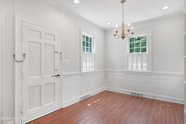626 Anson Ave, Rockingham, NC 28379 - foyer entrance featuring ornamental molding, a wainscoted wall, a chandelier, recessed lighting, and wood finished floors