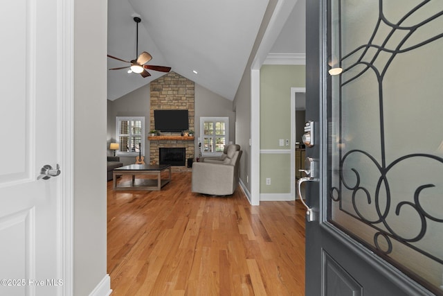 195 Devonshire Ave W, Seven Lakes, NC 27376 - foyer entrance with a ceiling fan, a stone fireplace, lofted ceiling, light wood-style flooring, and baseboards