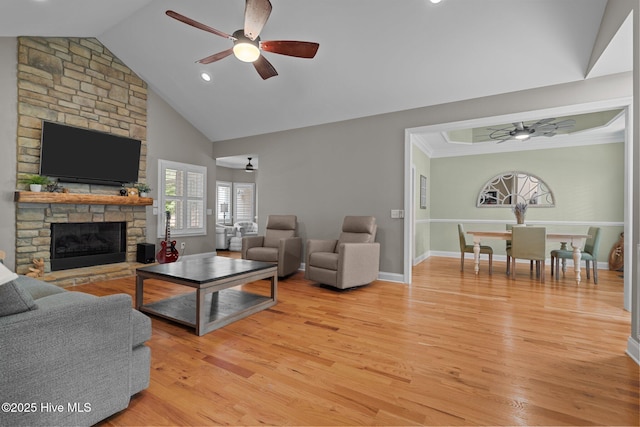 195 Devonshire Ave W, Seven Lakes, NC 27376 - living room with ceiling fan, a fireplace, light wood-style flooring, baseboards, and vaulted ceiling