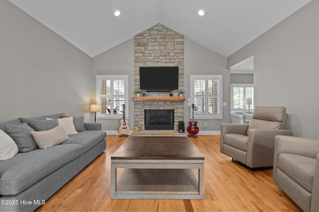 195 Devonshire Ave W, Seven Lakes, NC 27376 - living area featuring a fireplace, light wood-style floors, baseboards, high vaulted ceiling, and recessed lighting
