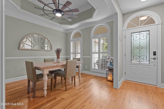 195 Devonshire Ave W, Seven Lakes, NC 27376 - dining space with ceiling fan, ornamental molding, light wood-type flooring, a raised ceiling, and baseboards