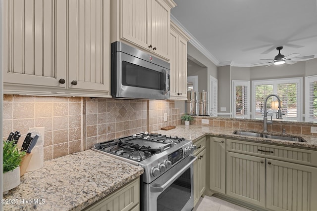 195 Devonshire Ave W, Seven Lakes, NC 27376 - kitchen featuring stainless steel appliances, a sink, ceiling fan, tasteful backsplash, and light stone countertops