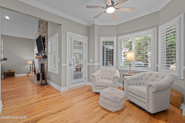 195 Devonshire Ave W, Seven Lakes, NC 27376 - living area featuring wood finished floors, ceiling fan, a fireplace, crown molding, and baseboards