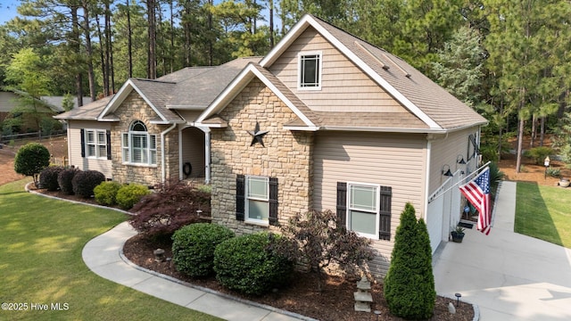 195 Devonshire Ave W, Seven Lakes, NC 27376 - craftsman-style home with stone siding, a front yard, roof with shingles, and concrete driveway