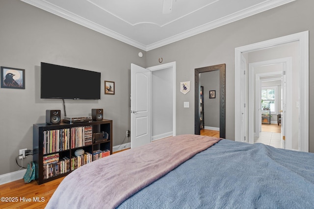 195 Devonshire Ave W, Seven Lakes, NC 27376 - bedroom featuring crown molding, light wood-style flooring, baseboards, and a ceiling fan