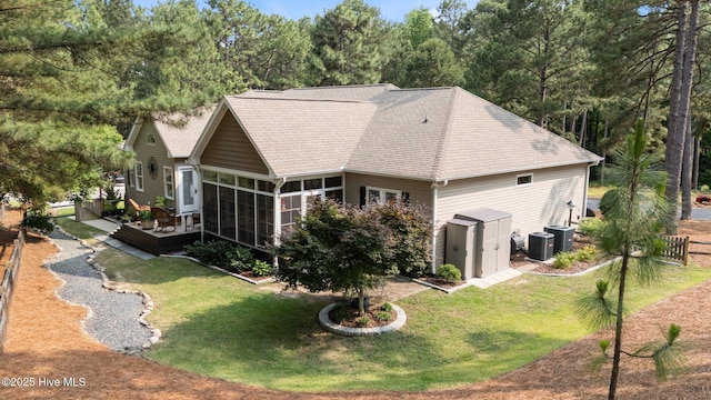 195 Devonshire Ave W, Seven Lakes, NC 27376 - back of house with a sunroom, a deck, central air condition unit, and roof with shingles