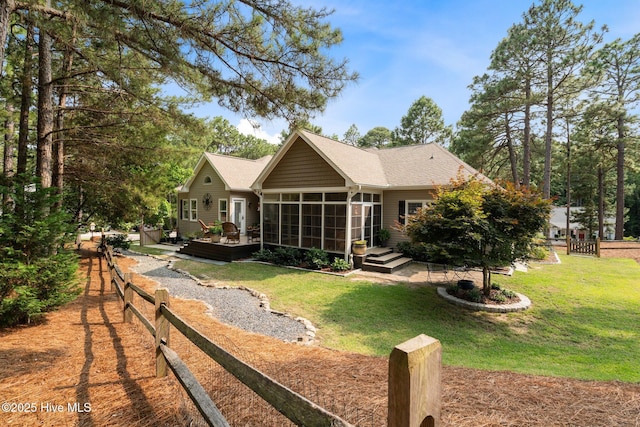 195 Devonshire Ave W, Seven Lakes, NC 27376 - rear view of house with a sunroom, a deck, and roof with shingles