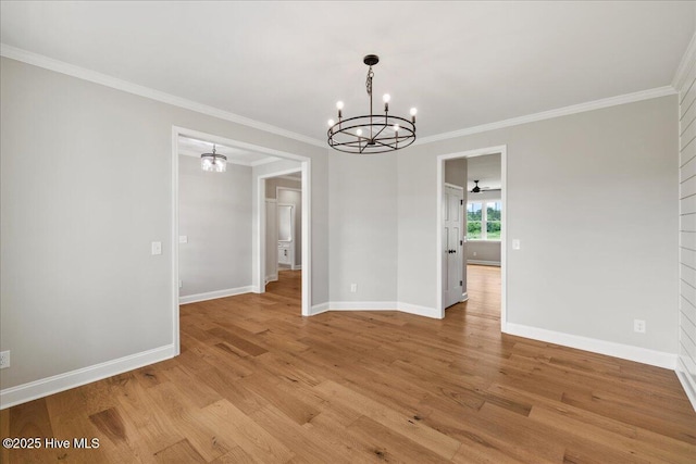 2259 Heartland Rd, Battleboro, NC 27809 - unfurnished dining area featuring a chandelier, crown molding, light wood-type flooring, and baseboards