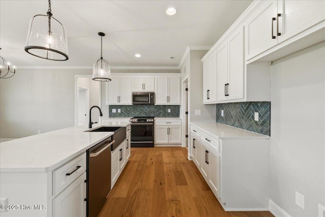 2259 Heartland Rd, Battleboro, NC 27809 - kitchen with stainless steel appliances, ornamental molding, white cabinets, decorative backsplash, and recessed lighting