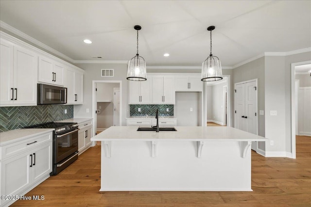 2259 Heartland Rd, Battleboro, NC 27809 - kitchen featuring black appliances, a sink, ornamental molding, tasteful backsplash, and white cabinets
