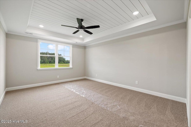 2259 Heartland Rd, Battleboro, NC 27809 - empty room featuring a raised ceiling, baseboards, carpet flooring, ornamental molding, and ceiling fan